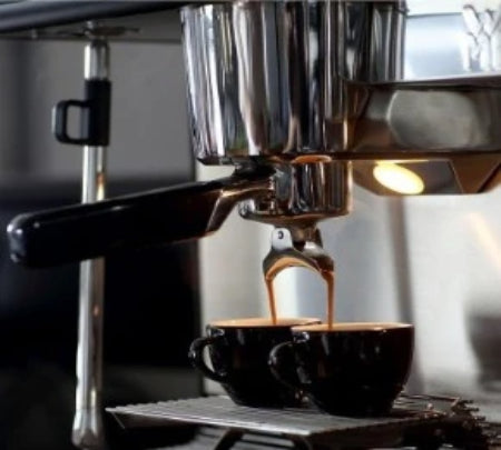 WMF Hybrid portafilter pouring espresso shots